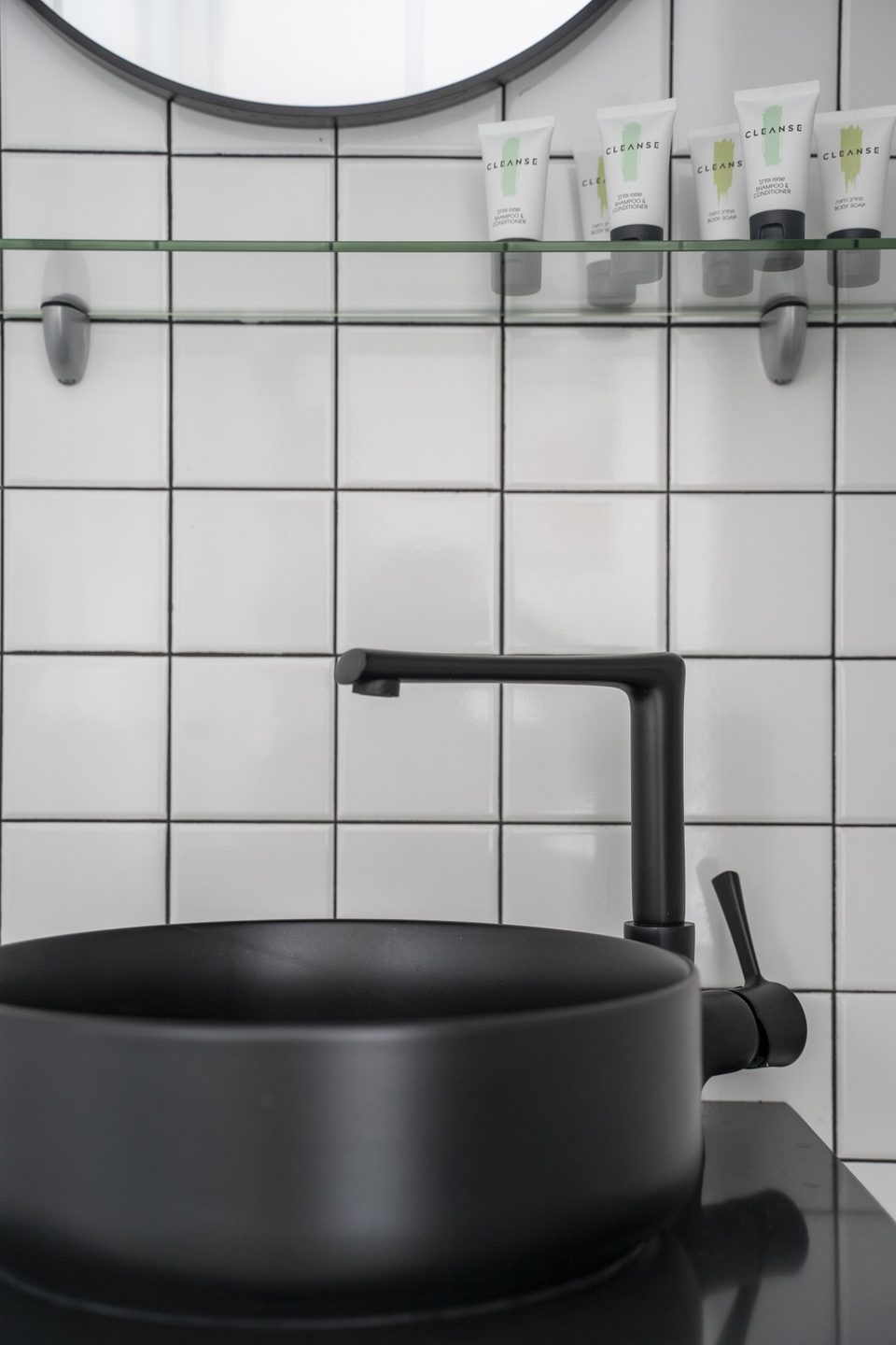 Black basin and tap in the bathroom