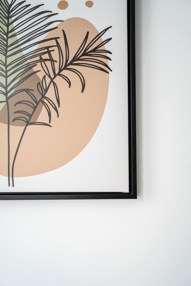 Framed botanical artwork on a white wall