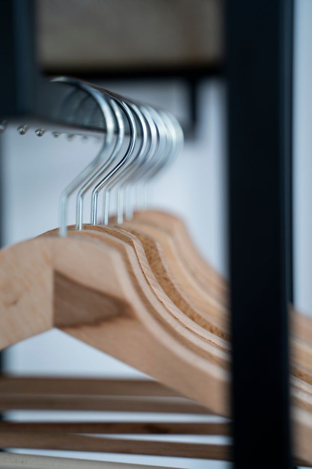 Wooden hangers in the room wardrobe